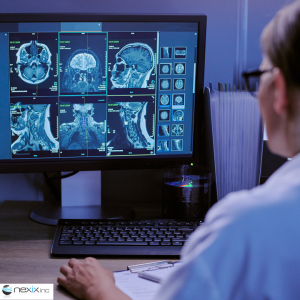 A doctor watching X-ray results on a computer