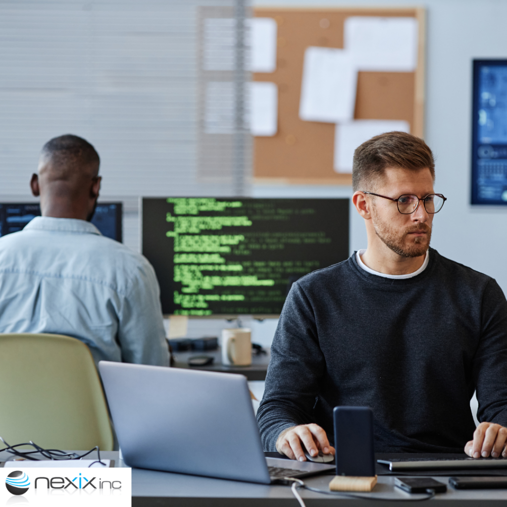 2 men working on computers coding