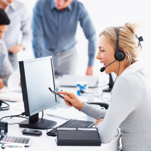 A woman talking with a headset in a call center