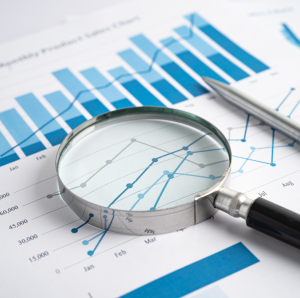 charts with a magnifying glass
