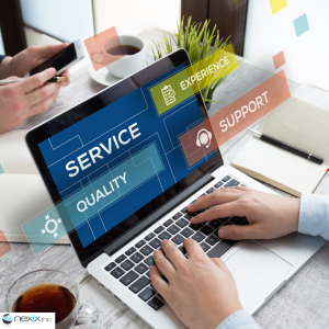 Hands typing on a laptop that displays service, quality, support and experience
