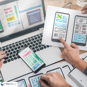 Two people analyzing an app on paper and computer