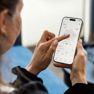 A woman viewing her mobile app development from her phone