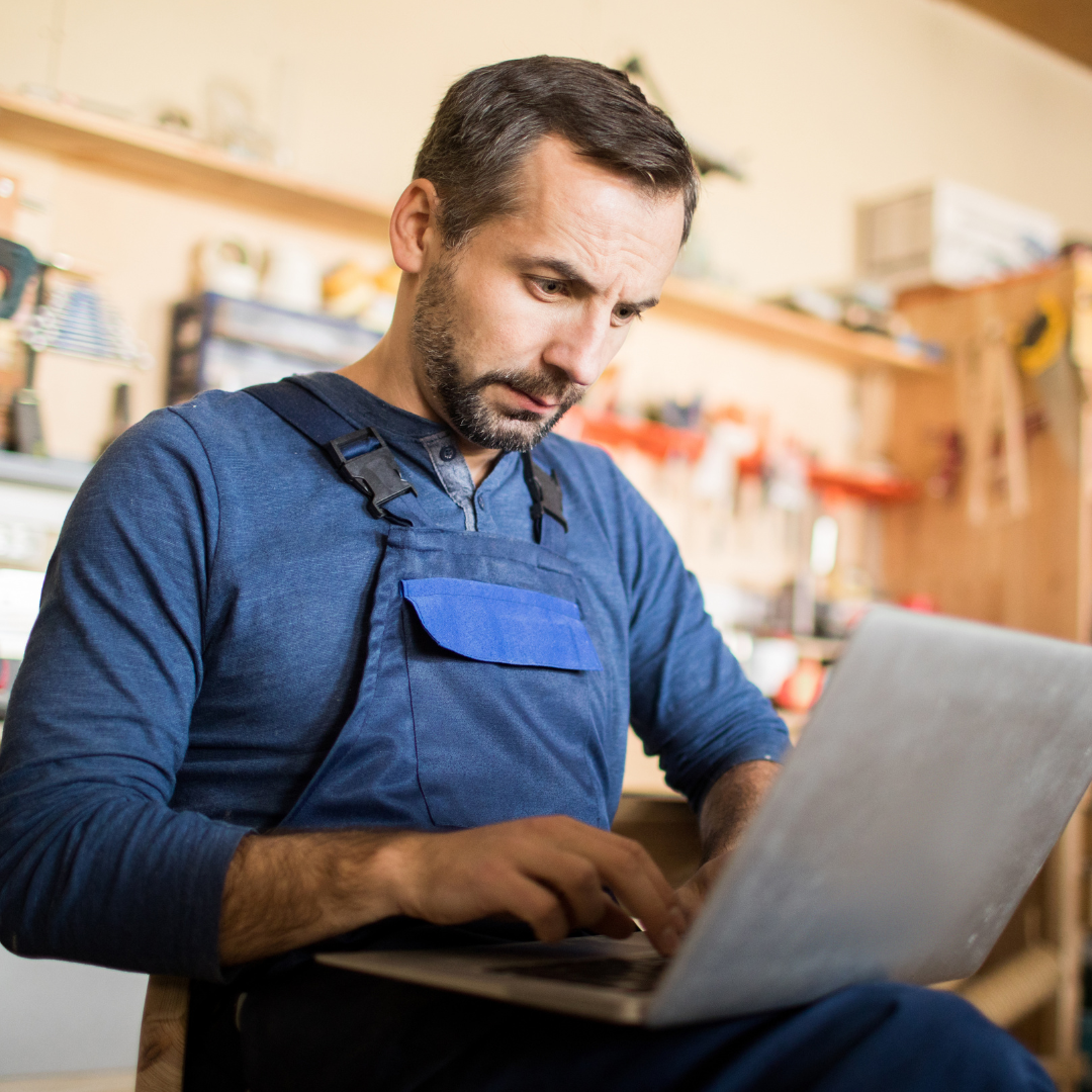 Small business owner on his computer