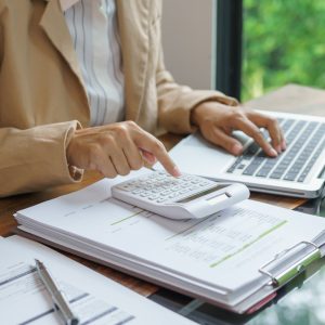 Person doing their budget on desk