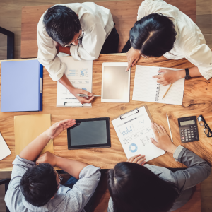 4 people reviewing documents for budget